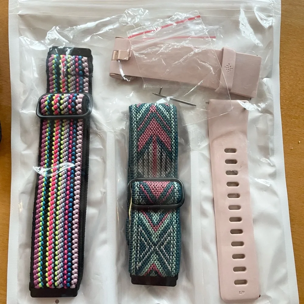 Fitbit Versa. Used once. Rose gold with original pink band